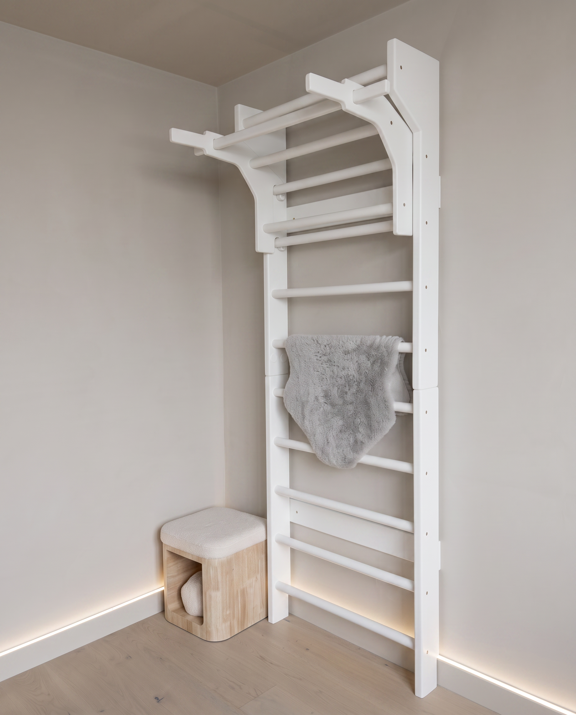 A practitioner seated in stillness beside the ladder