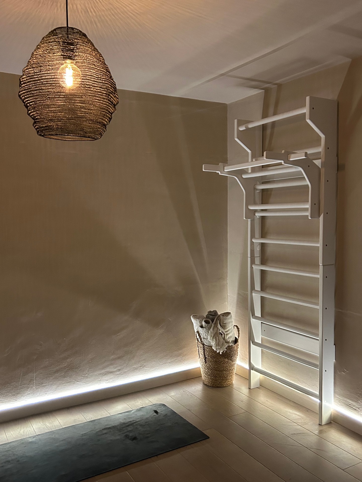 A practitioner in a long passive hang at the FRAYME